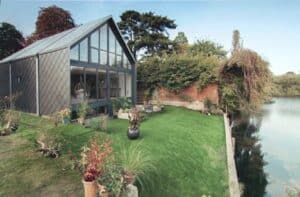 The first of the UK's amphibious houses: Formosa, beside the River Thames near Marlow, designed to float in its dock during floods