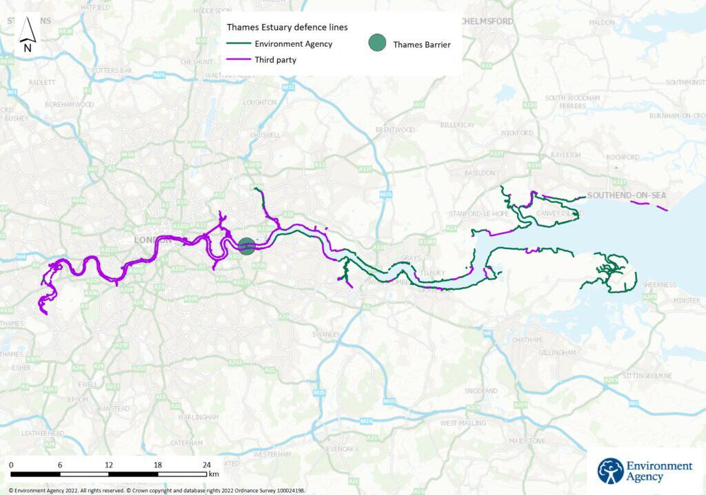 Map showing Thames Estuary defence lines near London. Green lines mark defences by the Environment Agency, purple by third parties, and a red dot indicates the Thames Barrier. Major towns and rivers are shown.