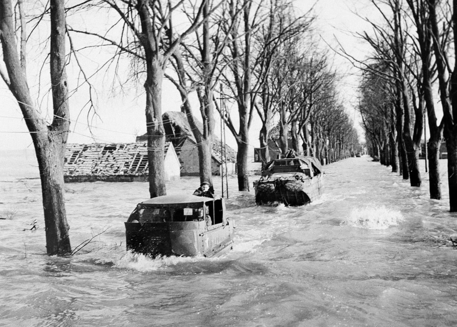 Allied vehicles negotiating flooded terrain near Kranenburg during Operation Veritable, 1945