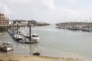 The River Arun reaching the sea at Littlehampton, in the district where the Arun SuDS design checklists set the drainage evidence bar.