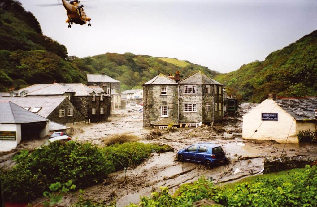 A Royal Navy Sea King rescue helicopter hovers over Boscastle