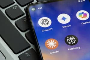 AI chatbot apps including ChatGPT, Claude and Gemini on a smartphone, raising the question can AI write a flood risk assessment.