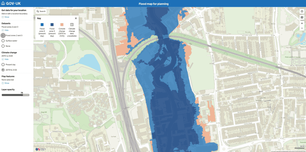 Flood map for planning showing Flood Zones 2 and 3 along the River Wey in central Guildford, with the climate change extent to 2125.