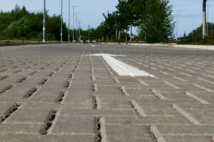 Close-up of permeable block paving on an access road, the kind of surface used as permeable paving for planning applications.