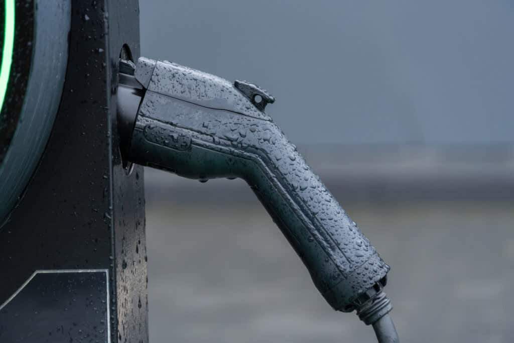 Rainwater beading on an EV charge point connector, the exposed kit a flood risk assessment for EV charging must account for.