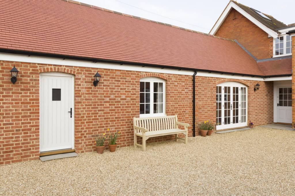 Single-storey brick granny annexe attached to the main house, the kind of build a granny annexe flood risk assessment supports.