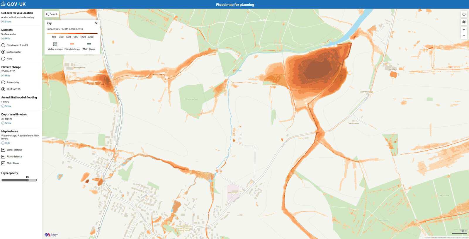 Surface water flood map for the village where homes were approved beside protected watercress beds, showing 1 in 100 year depths with climate change.