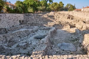 Terraced stone footings under excavation at Liman Tepe, Urla, the site that reopened the question of the oldest drainage system in the world.