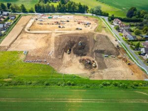 Bulk earthworks regrading a greenfield housing site, the work behind any attempt to raise land out of the floodplain.