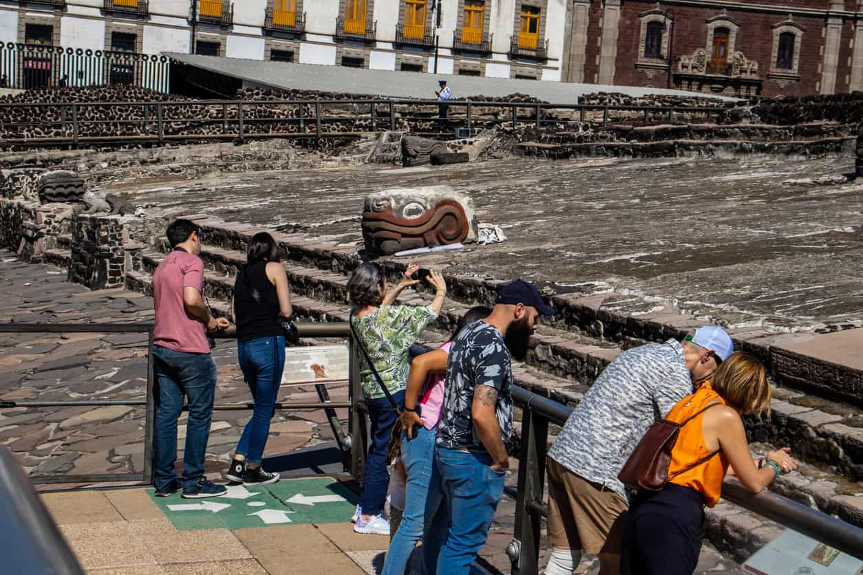 Visitors above the excavated Templo Mayor in the historic centre, where the Mexico City sinking runs slower than out on the old lakebed.