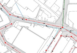 Public sewer map extract from Thames Water showing foul and surface water sewers, manholes, pipe sizes and flow arrows along a street.