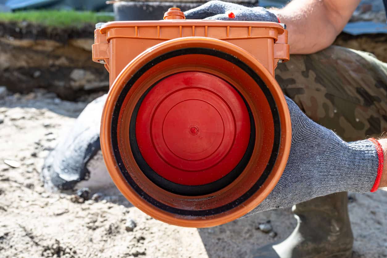 In-line non-return valve for an underground drain, a passive part of flood defences for homes that stops sewer backflow.
