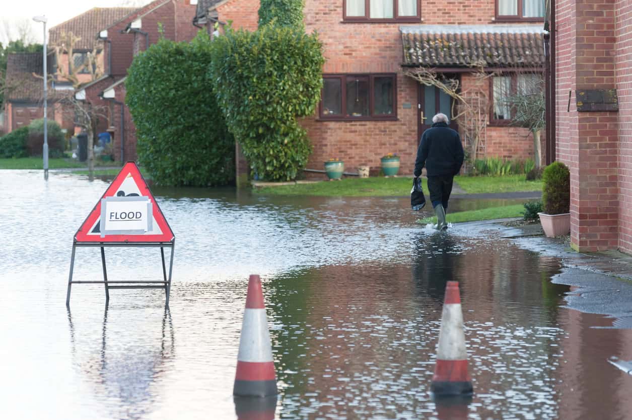 Thames floodwater across a residential street near Windsor in 2014, the kind of shallow river flooding flood defences for homes are built for.